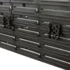A close-up view of black plastic organizers with hexagonal cutouts, likely for storing tools or cables. Produktbild-Vorschau