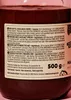 A close-up of a jar of date and hazelnut spread, showing the label with nutritional information and ingredients in multiple languages. Produktbild-Vorschau