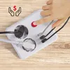 A hand is pressing a red button on a white power strip with multiple outlets and USB ports, with cables plugged in. Voir les images du produit