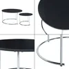 A collage of four images showing a set of two nesting coffee tables with black tops and chrome legs. Produktbild-Vorschau