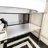 Close-up of a shelf with towels on it, part of a bathroom or vanity. Produktbild-Vorschau