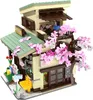 A detailed model of a Japanese-style building with cherry blossoms. Produktbild-Vorschau
