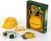 A set of toy construction worker accessories, including a hard hat, goggles, ear defenders, and gloves, displayed in and around its retail packaging. Náhled obrázku produktu