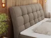 A close-up view of a bed's upholstered headboard and mattress. Produktbild-Vorschau