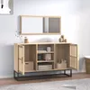 A wooden sideboard with open doors and shelves, displaying various items like a toaster, mug, and storage boxes. Produktbild-Vorschau