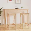 A wooden bar table with two bar stools in front of it, set against a white wall. Voir les images du produit