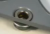 A close-up view of a metal mechanism with screws and washers. Produktbild-Vorschau