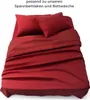 A red bed with sheets and pillows. Náhled obrázku produktu