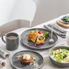 A table setting with a meal and drinks, suggesting a dining experience. Náhled obrázku produktu
