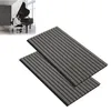 A person playing a piano in a room with acoustic panels on the wall. Produktbild-Vorschau