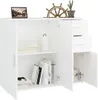 A white sideboard with open doors and drawers, displaying books and decorative items. Produktbild-Vorschau
