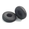 Two black ear pads for headphones are shown on a white background. Produktbild-Vorschau