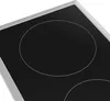 A close-up view of a black ceramic glass cooktop with two circular heating zones outlined in white. Náhľad obrázku produktu