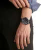 A person's wrist wearing a watch. Produktbild-Vorschau