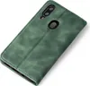 A green flip cover phone case is shown from a diagonal angle on a white background. Produktbild-Vorschau