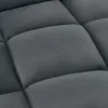 A close-up view of a quilted, dark gray fabric, likely upholstery. Náhled obrázku produktu