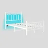 A white metal bed frame with a headboard and footboard, shown from a side angle against a light gray background. Produktbild-Vorschau