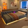 A modern bedroom with a gray daybed, decorative pillows, and ambient LED lighting. Produktbild-Vorschau