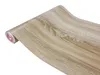 A roll of wood-grain contact paper or wallpaper. Produktbild-Vorschau