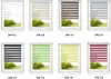 A collage of different roller blind designs shown in windows with a landscape view. Produktbild-Vorschau