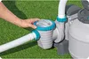 A hand is shown adjusting the lid of a pool filter pump system set up on a grassy lawn. Produktbild-Vorschau