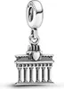 A silver charm shaped like the Brandenburg Gate in Berlin, with the word "BERLIN" inscribed on the bail. Produktbild-Vorschau