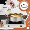 A hand is shown lifting the lid of a pot of soup on an induction cooktop. Náhled obrázku produktu