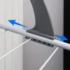 A close-up view of a gray plastic clip mechanism on a white metal rod, with blue arrows indicating movement. Produktbild-Vorschau