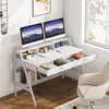 A modern white desk with dual monitors, keyboard, headphones, and drawers, set up in a home office environment with a window in the background. Anteprima dell’immagine prodotto