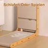 A cat scratching post and play structure is shown against a wall and floor. Produktbild-Vorschau