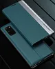 A teal flip case for a smartphone is shown, with the phone itself visible underneath. Produktbild-Vorschau