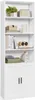 A tall white bookshelf with several shelves and two doors at the bottom, displaying various decorative items and books. Náhled obrázku produktu