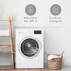 A washing machine and laundry basket in a clean, modern room. Voir les images du produit