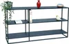 A dark grey metal console table with three shelves, decorated with a plant, books, a vase, a bird figurine, and a decorative bowl. Produktbild-Vorschau