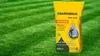 A bag of grass seeds is placed on a mowed lawn. Náhľad obrázku produktu