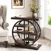 A narrow wooden side table with a metal frame and multiple shelves is placed next to a tufted armchair in a living room setting. Anteprima dell’immagine prodotto