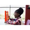 A young girl is sitting at a table and playing with a colorful abacus. Produktbild-Vorschau