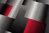 A close-up, abstract view of a patterned rug with geometric shapes and a gradient effect. Produktbild-Vorschau