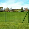 A green wire mesh fence in a grassy field with trees and a building in the background. Produktbild-Vorschau