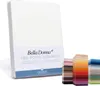 A white fitted sheet is shown standing upright, with a label indicating the brand and product name. To the right, a stack of fabric swatches in various colors is displayed. Produktbild-Vorschau