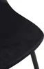 A close-up view of a black velvet chair seat and a black metal leg. Anteprima dell’immagine prodotto