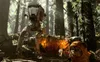 A Star Wars AT-ST walker and an Ewok in a forest setting. Produktbild-Vorschau
