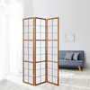 A room divider is placed in a bright room next to a couch. Náhled obrázku produktu