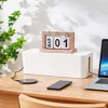 A desk setup with a cable management box, a laptop, a smartphone, and a wireless charger. Anteprima dell’immagine prodotto