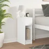 A white nightstand with a drawer and an open shelf, placed next to a bed. Produktbild-Vorschau