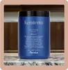 A blue bottle of hair mask sits on a marble countertop with a blurred background of wooden cabinets. Podgląd zdjęcia produktu