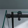 A close-up view of a black sliding shower door mechanism with glass panels. Produktbild-Vorschau