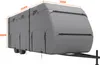 A grey travel trailer cover is shown on a trailer frame against a white background. Dimensions are indicated with orange text. Podgląd zdjęcia produktu