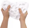 Hands holding and shaping white modeling clay. Anteprima dell’immagine prodotto