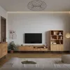 A modern living room with a TV stand, bookshelf, and sofa. Produktbild-Vorschau